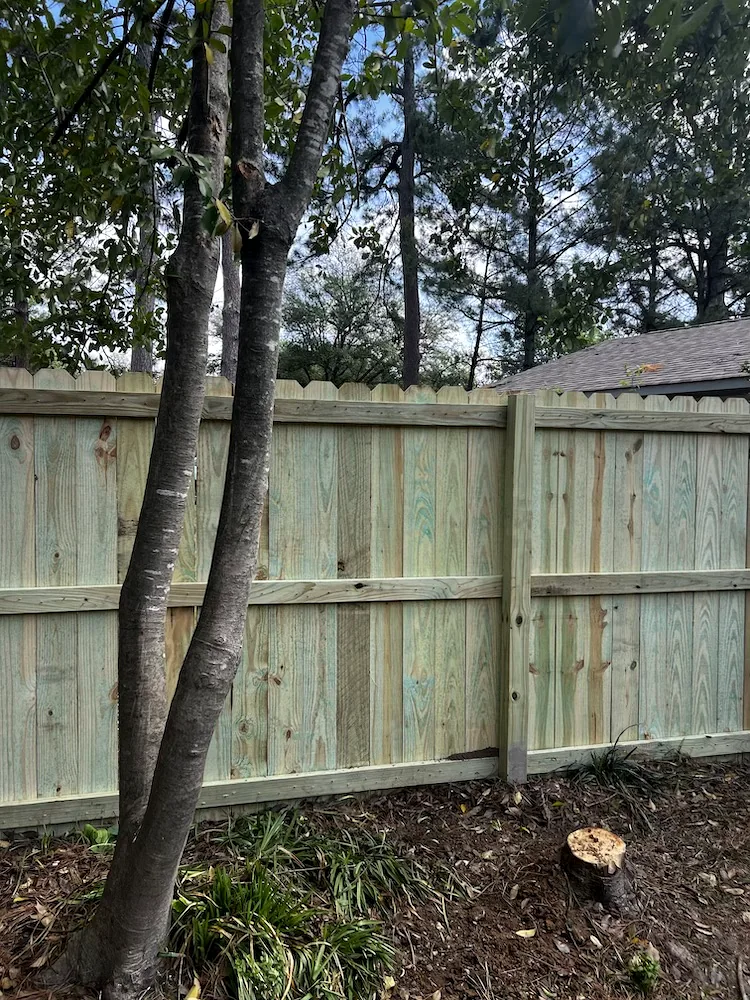 Wood privacy fence installed by Herring Roofing and Construction